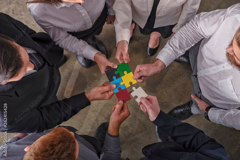 Poster teamwork of partners. concept of integration and startup with puzzle pieces.