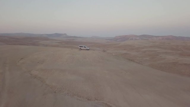 A van on top of a hill near the cliff in Mount Sodom circa March 2019