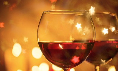 Wine glasses in a restaurant setting close up .