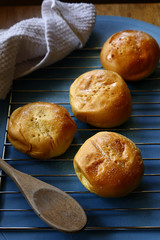 Photo of freshly baked Filipino delicacy called Pan de Coco or bread roll with sweetened coconut filling