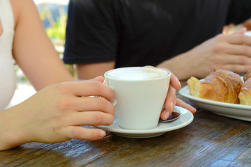 Close up shot of hot coffee cup on a table