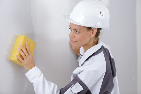 woman washing the wall