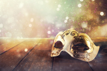 Stll life of a carnival mask on a wood floor