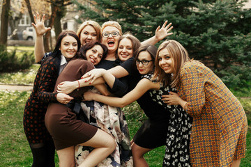 stylish elegant women having fun at celebration in sunny park, funny moment concept, gathering...