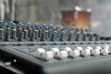 Mixing console close-up. Sound check for the concert. Mixer control. Music equipment and technology...