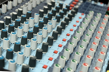 Mixing console close-up. Sound check for the concert. Mixer control. Music equipment and technology...