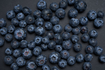 Closeup view of fresh blueberry on black background