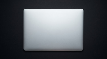 Laptop on black background,top view
