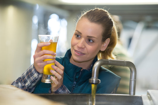 Female Brewer Testing Beer