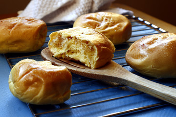 Freshly baked Filipino delicacy Pan de Coco or bread roll with sweetened coconut filling