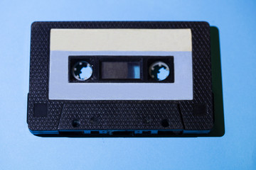 Obraz premium old audio cassette isolated on blue background