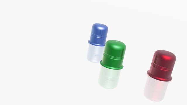 Three color thimbles on white backgrounds - metaphor.