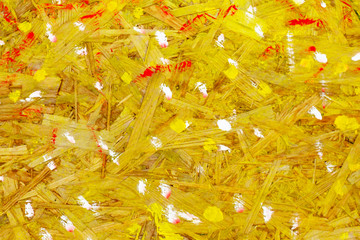 brush strokes on a yellow surface