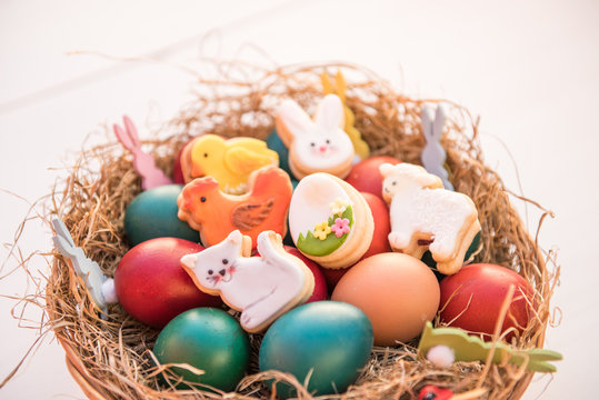 basket with painted colorful easter eggs 