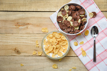 Cornflakes breakfast and various cereals in bowl milk cup on wooden table background for cereal healthy food