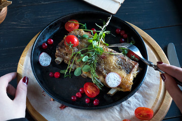 Baked pork ribs with vegetables in a pan