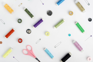 White background with different tools for sewing and tailoring	