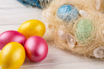 Easter eggs on rustic wooden table. Holiday background.