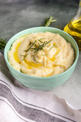 Bowl with tasty mashed potato on table