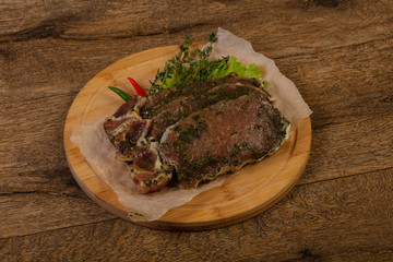 Raw marinated pork steak