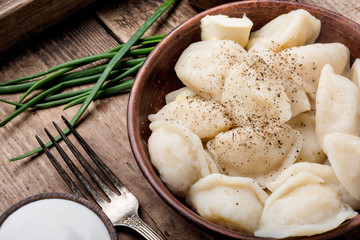 Dumplings with potatoes in plate