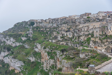 Fototapeta na wymiar Caves in a Mountain at The Ancient City of Matera, Italy