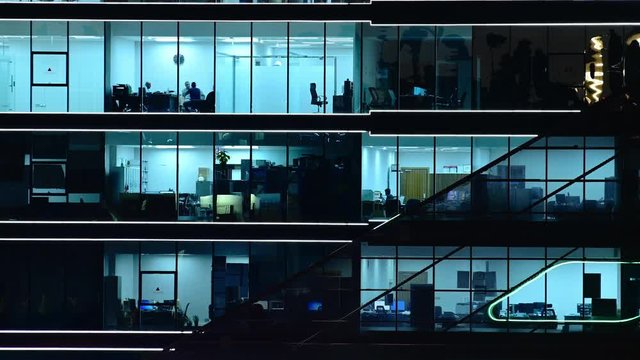 Closeup of office block with people working in the offices, Doha, Qatar