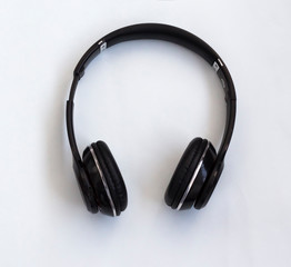 Fototapeta na wymiar wireless Bluetooth headphones for listening to music, watching movies and answering phone calls