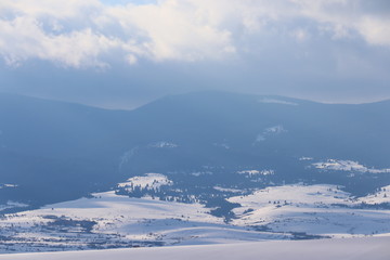 Mountain winter landscape of snowed forest