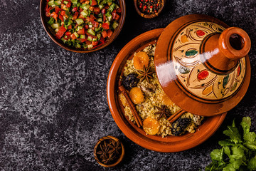 Traditional moroccan tajine of chicken with dried fruits and spices.