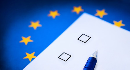 Voting card against the background of the European Union flag. Elections to the European Parliament, voting for candidates.