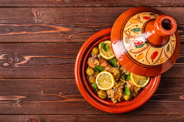 Traditional moroccan tajine of chicken with salted lemons, olives