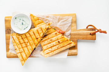 mexican quesadilla with meat, pepper and sauce