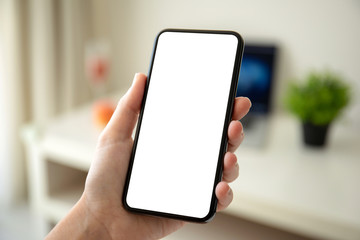 female hands holding phone with isolated screen in the room