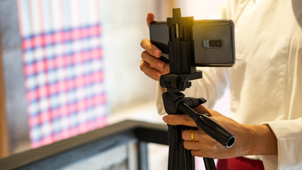 Take pictures with your mobile phone on a tripod.