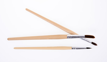 Painting brushes. Drawing tools, paint brushes on white background, copy space, top view