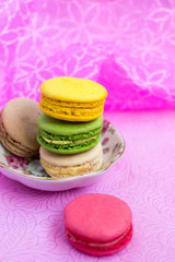 Macaroons fresh colorful close up. French dessert food background.