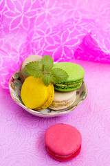 Macaroons fresh colorful close up. French dessert food background.