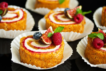 a piece of carrot cake with berries.