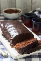 Vegan Mexican chocolate cake with chili, cinnamon and chocolate icing served with coffee.