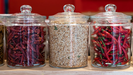 Bottles with fresh chilies and dried chillies and rice