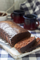 Vegan Mexican chocolate cake with chili, cinnamon and chocolate icing served with coffee.