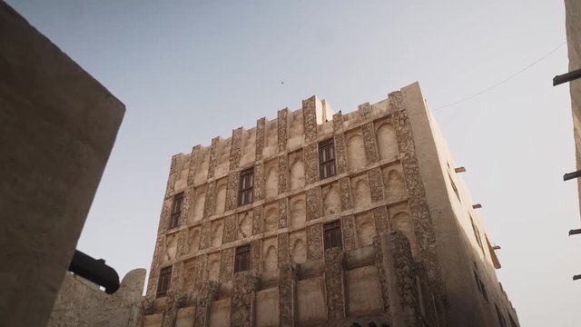 Smooth slow motion low angle movement with old heritate buildings in Souq Waqif in Doha, Qatar