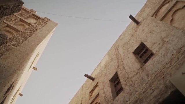 Smooth slow motion low angle movement with old heritate buildings in Souq Waqif in Doha, Qatar