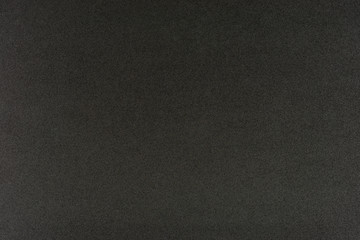 Black gradient color with texture from real foam sponge paper for background, backdrop or design.