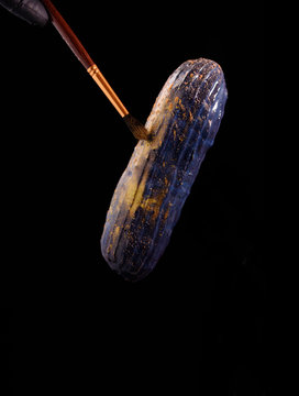 Beautiful bright eclair with blets on a dark background.