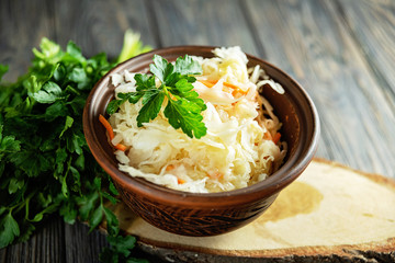 salad homemade sauerkraut in a glass jar on a table
