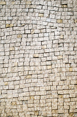 Fragment of the wall of white brick. Vertical photo.