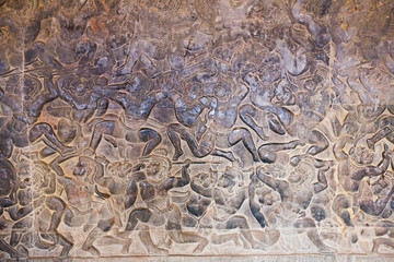 Stone Carving, all around on the wall at Angkor wat.