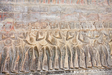 Stone Carving, all around on the wall at Angkor wat.